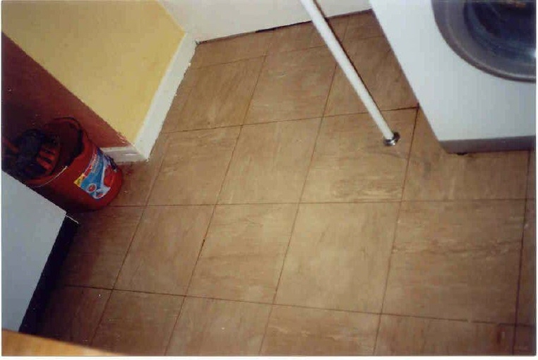Tiled floor with paint stains removed by Safer* Paint & Varnish Remover